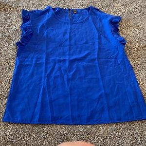 Women’s adorable ruffle royal blue blouse.